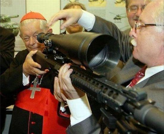 Vatican cardinal holding rifle